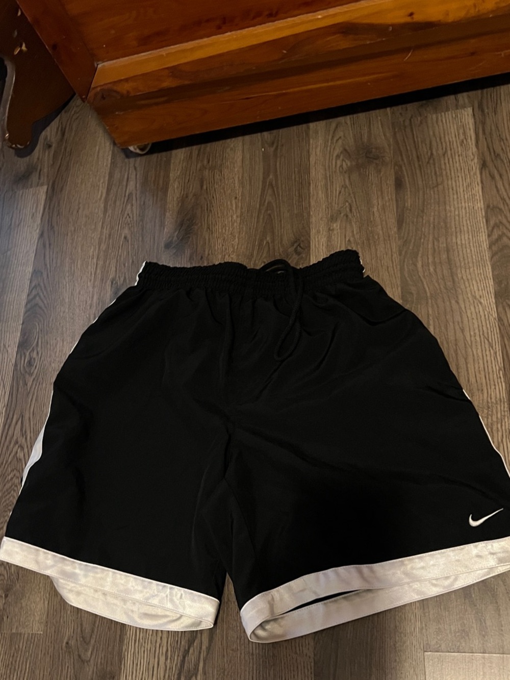 Nike Black Athletic Shorts with White Hem and Side Stripe